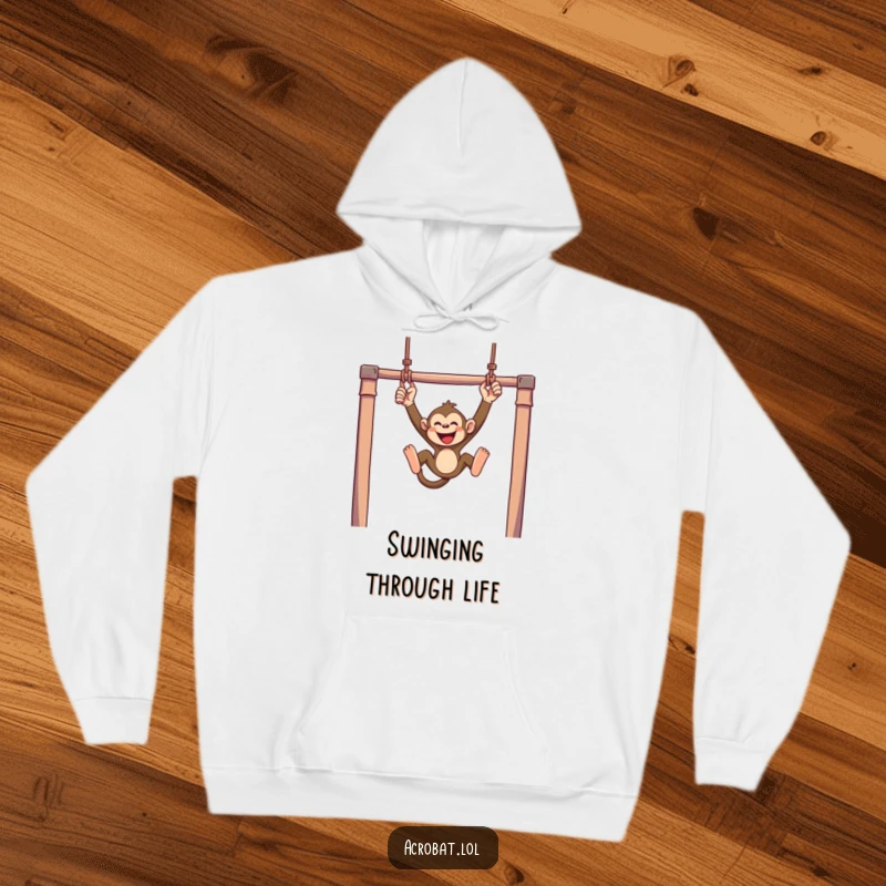 Funny monkey hoodie showcasing a mischievous monkey swinging with joyful abandon from trapeze bars, offering humorous comfort and playful vibes.